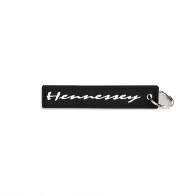 Black rectangular keychain written Hennessey in white in the middle