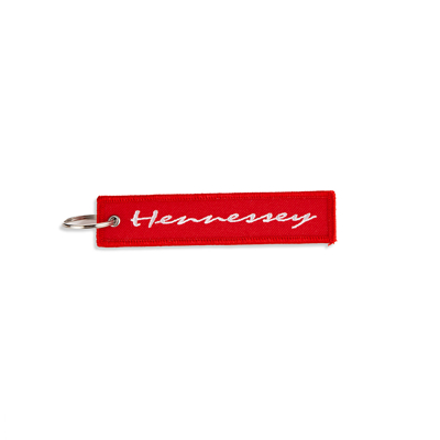Red Hennessey rectangular Keychain written Hennessey in white in the middle