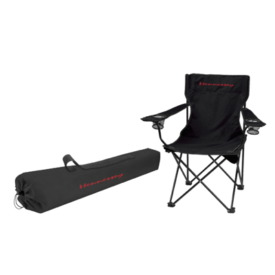 Image of a black folding chair with its bag, with the Hennessey logo in red on the chair and the bag